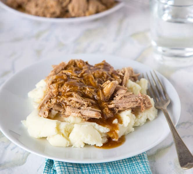 A plate of food on a table, with Cooker and Pork