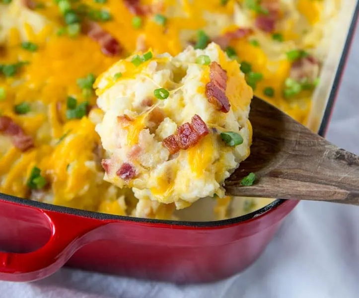 Loaded Twice Baked Potato Casserole - Turn twice baked potatoes into an easy cheesy potato casserole that will be sure to please. Loaded with garlic, cheese, and bacon!