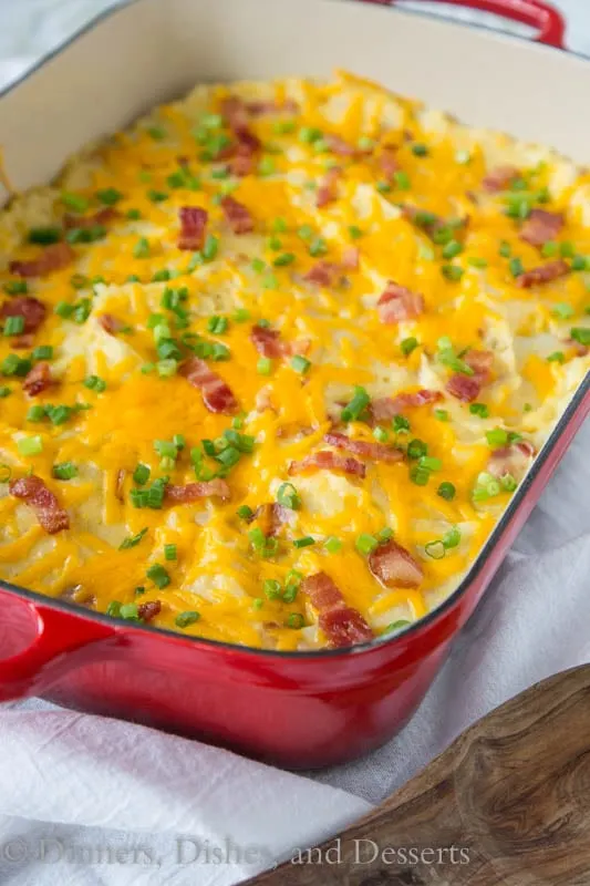 Loaded Twice Baked Potato Casserole - Turn twice baked potatoes into an easy cheesy potato casserole that will be sure to please. Loaded with garlic, cheese, and bacon!