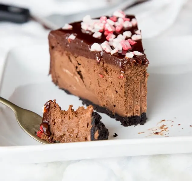 Peppermint Chocolate Cheesecake Recipe – a thick and creamy chocolate cheesecake with chocolate ganache and pieces of peppermint candy