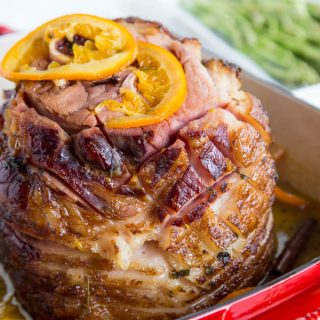 Tangerine Glazed Ham - a delicious baked ham with a sweet tangerine glaze. Perfect for any holiday table.