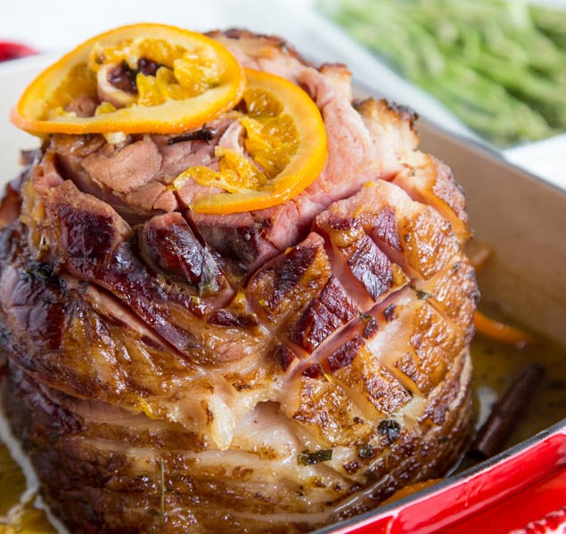 Tangerine Glazed Ham - a delicious baked ham with a sweet tangerine glaze. Perfect for any holiday table.