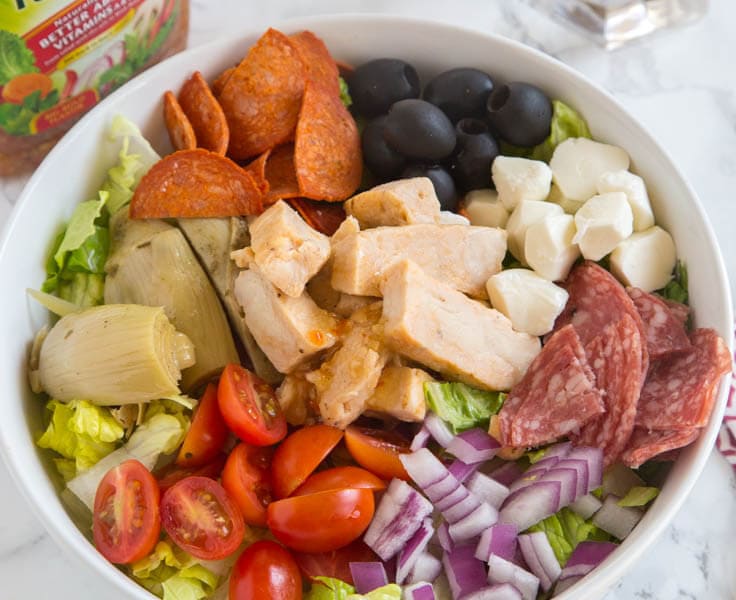 Grilled Chicken Antipasto Salad - An easy salad that comes together in minutes thanks to Tyson Chicken and Wishbone Italian Dressing.