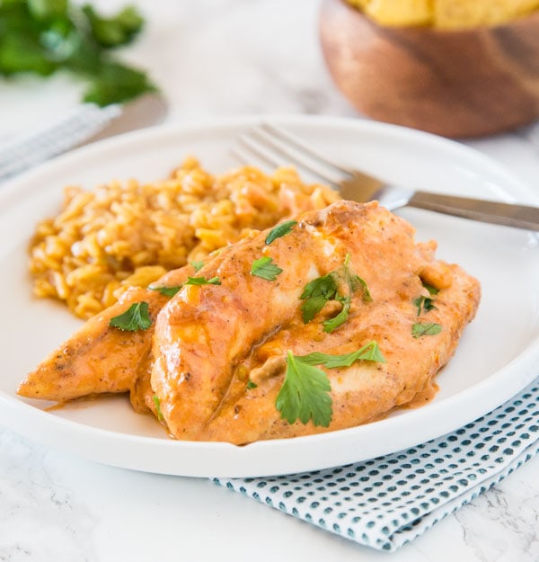 Creamy Salsa Chicken - Taco spiced chicken cooked with corn and salsa, and sour cream mixed in to make it creamy and delicious! One pan and 20 minutes!  