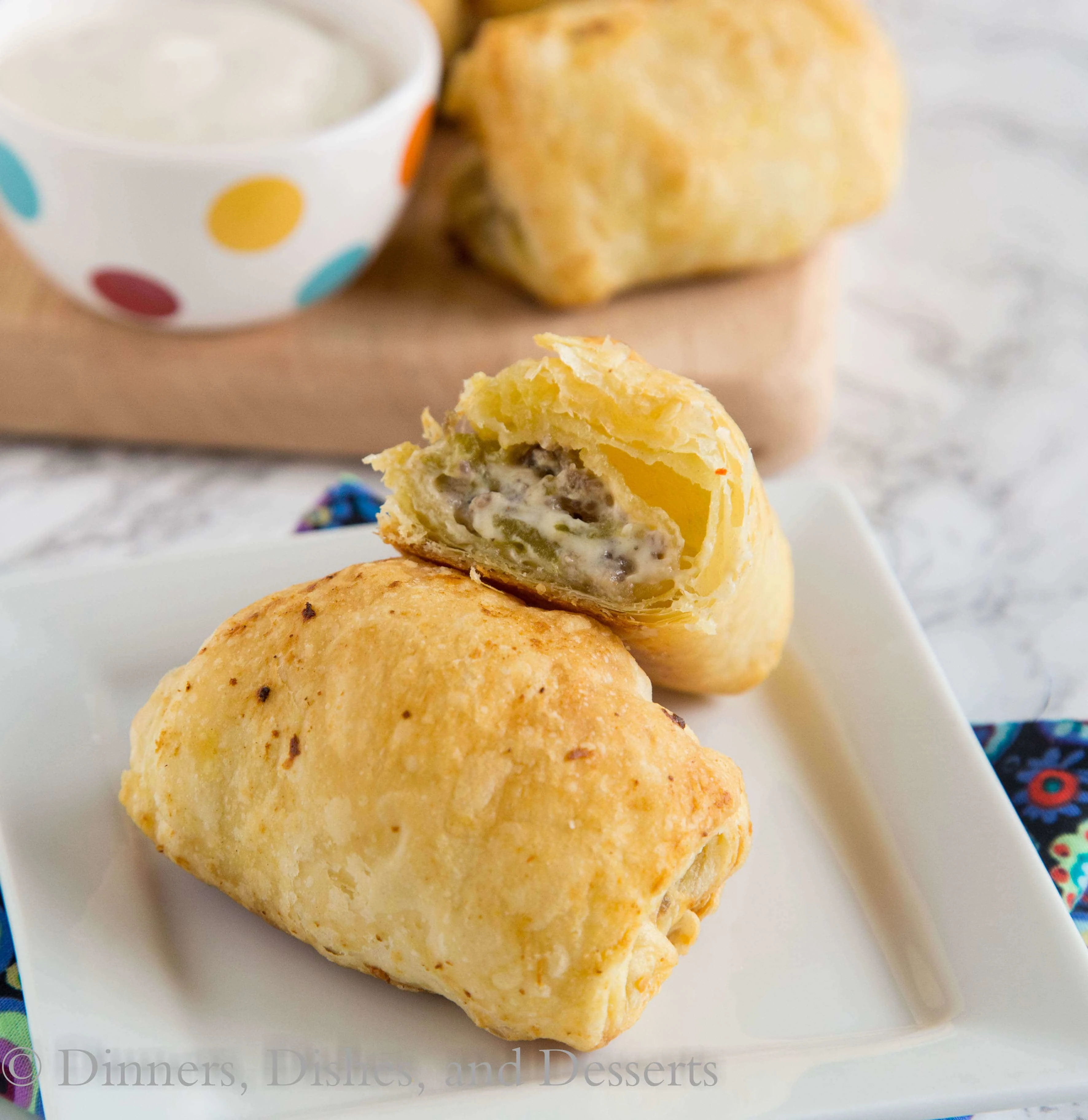 Spicy Sausage Rolls - Great for brunch or breakfast for dinner! A creamy, cheesy, spicy mixture with breakfast sausage is rolled with puff pastry and baked into flaky perfection!