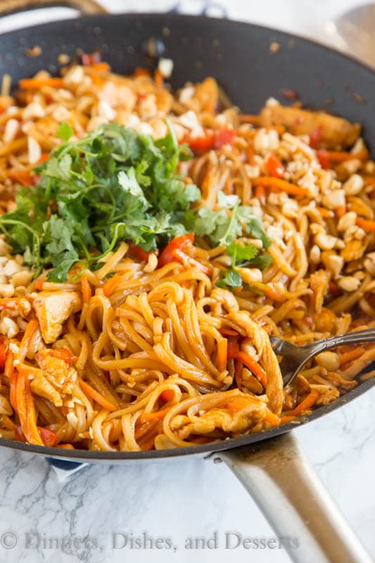 spicy thai noodles with chicken in a pan