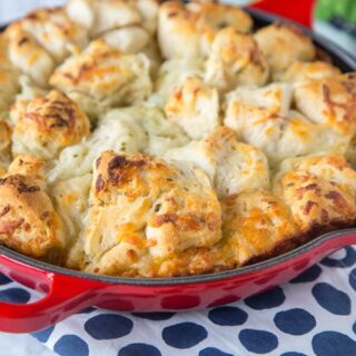 Italian Cheese Pull Apart Bread - make this easy side dish any night of the week. Open a can of biscuits, toss with butter, seasonings, cheese and bake!