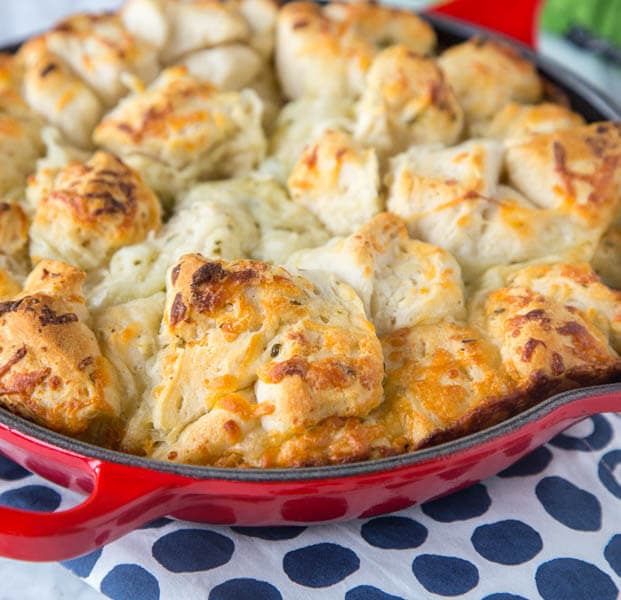 Italian Cheese Pull Apart Bread - make this easy side dish any night of the week. Open a can of biscuits, toss with butter, seasonings, cheese and bake!