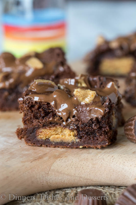 Peanut Butter Stuffed Brownies - rich, fudge brownies that are stuffed with peanut butter cups, topped with melted chocolate and more peanut butter cups!