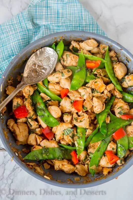 Spicy Basil Chicken - get dinner on the table in just minutes with the super easy chicken recipe. Great Asian flavors with just a little kick. Add veggies to make it a complete meal!