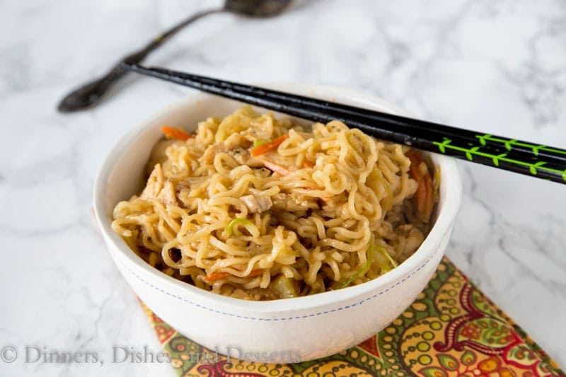 A bowl of rice on a plate, with Noodle and Chow mein
