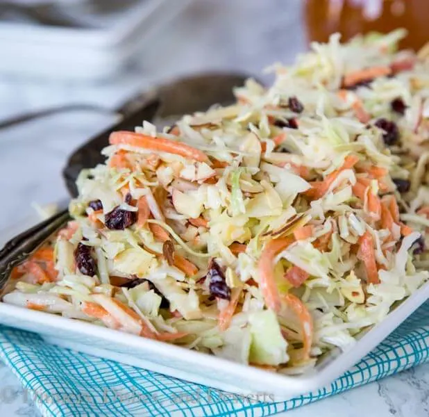 Cranberry Apple Coleslaw - an easy coleslaw recipe that you can make ahead of time, and bring to any summer get together. Or serve at home with just about anything!
