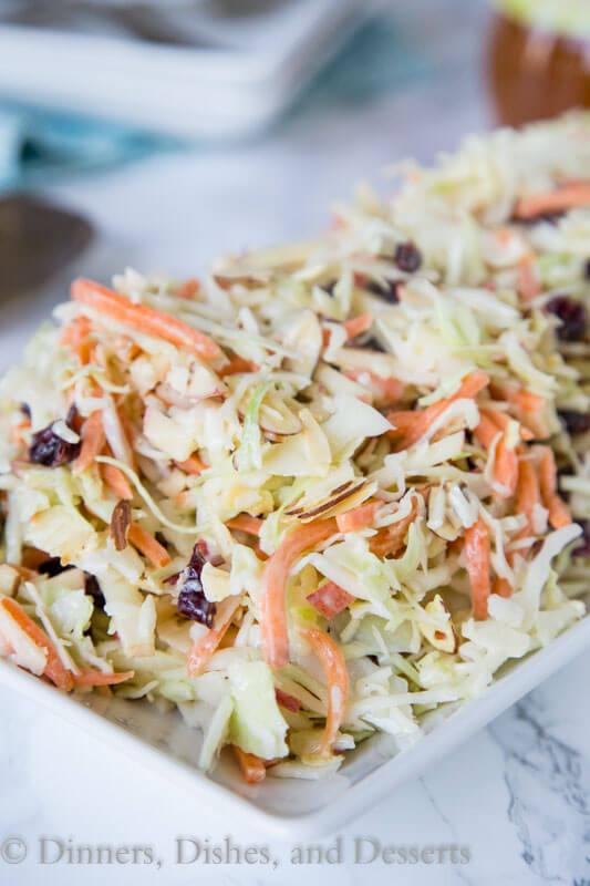 Cranberry Apple Coleslaw - an easy coleslaw recipe that you can make ahead of time, and bring to any summer get together. Or serve at home with just about anything!