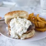 Greek Turkey Burgers - a great way to have burger night with a delicious twist! Greek flavored turkey burgers topped with tzatziki sauce and feta cheese!