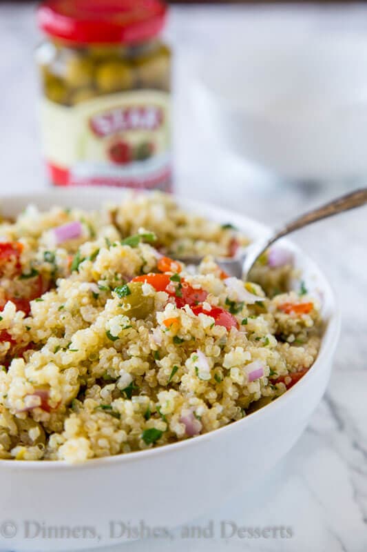 Mediterranean Quinoa Salad - a light and fresh quinoa salad with tomatoes, green olives and tossed with a lemon vinaigrette. Great warm or cold all year round!