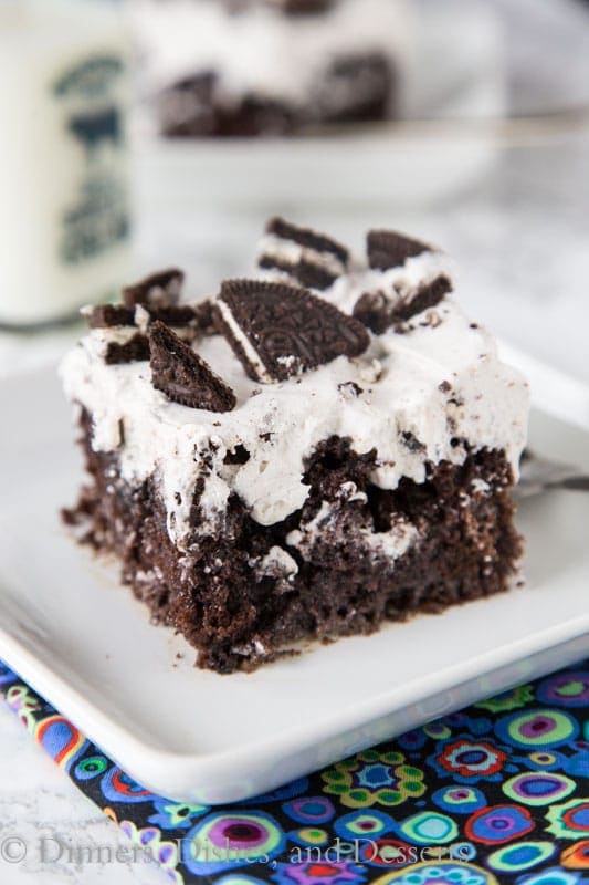 Oreo Poke Cake - An easy chocolate cake topped with an Oreo pudding and whipped cream mixture. Light, creamy, and so good!