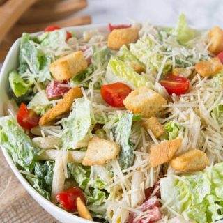Caesar Pasta Salad - combine two favorites for one perfect summer side dish. Caesar salad and pasts salad come together in an easy dish everyone will love!