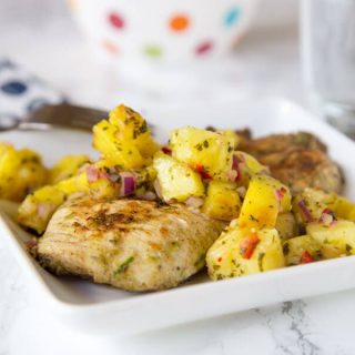 Jerk Chicken with Pineapple Salsa - a spicy and sweet grilled chicken recipe that comes together quickly. You will be craving the Tall, Dark & Delicious ice cream cake to cool down for dessert.