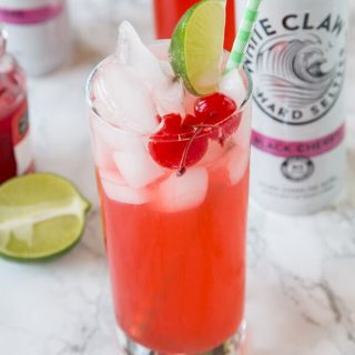 Black Cherry Limeade - a fun and easy cocktail recipe! Add a little sweetness to your limeade with Black Cherry Hard Seltzer.