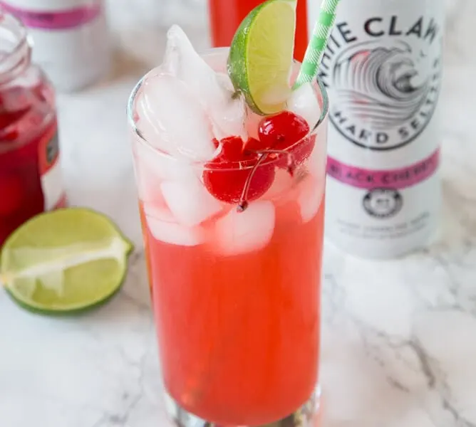 Black Cherry Limeade - a fun and easy cocktail recipe! Add a little sweetness to your limeade with Black Cherry Hard Seltzer.
