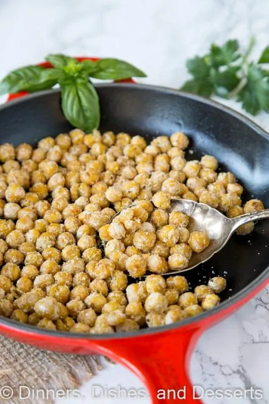 chickpeas in a skillet with basil