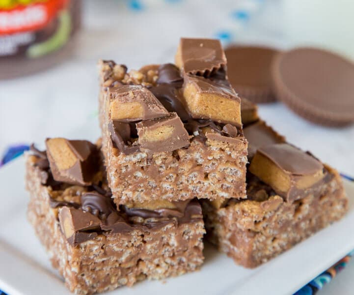 Reese's Peanut Butter Rice Krispie Treats - An easy Rice Krispie treat made with Reese's peanut butter spread, topped with chocolate and peanut butter cups!