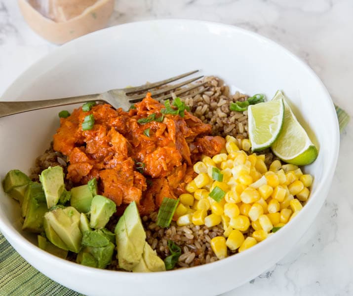 Barbecue Salmon Bowls - Ready in 10 minutes and so easy!! Barbecue salmon over rice with corn, avocado, and a yummy sauce.