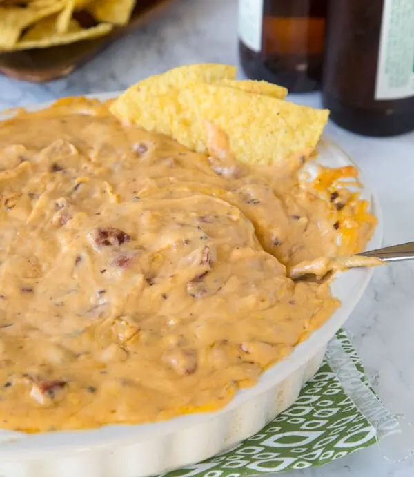 Cheddar Brat Cheese Dip - a warm, gooey cheese dip made with cheddar brats for so much extra flavor! Game day just got better!
