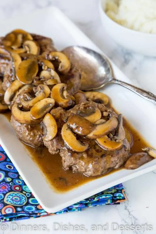 A plate of food on a table, with Mushroom and Steak