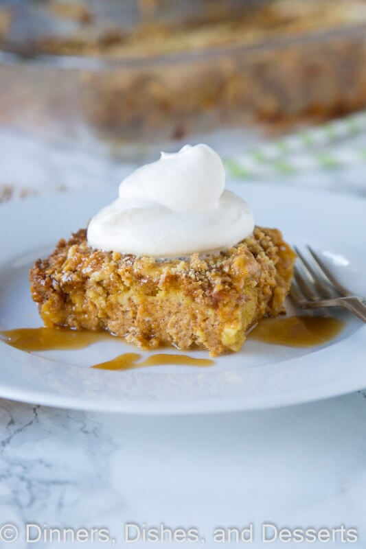 Pumpkin Dump Cake - a super easy, 6 ingredient cake that you can put together in minutes. Top with whipped cream and caramel for an amazing fall treat!