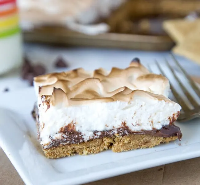 Sheet Pan S'mores Tart - S'mores aren't just for around the campfire, check out this tart with a light marshmallow meringue type topping!