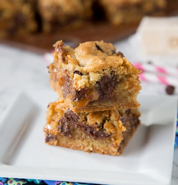 Chocolate Chip Caramel Cookie Bars - classic chocolate chip cookies baked in to bars with a gooey layer of caramel in the middle!