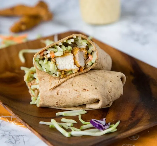 Honey Sesame Chicken Salad Wraps - Broccoli slaw coated in a creamy honey sesame dressing. Wrapped with crispy chicken for a quick and easy meal.