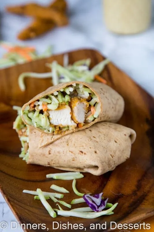 Honey Sesame Chicken Salad Wraps - Broccoli slaw coated in a creamy honey sesame dressing. Wrapped with crispy chicken for a quick and easy meal.