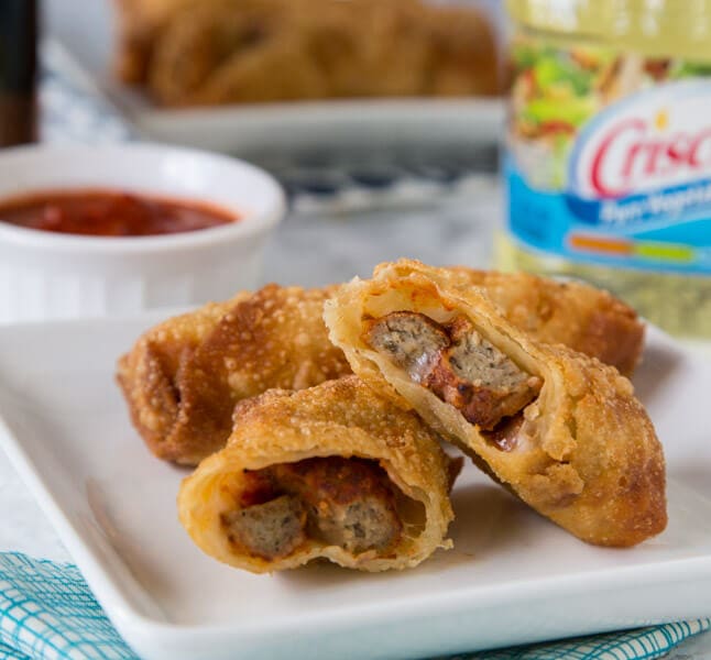 Meatball Sub Egg Rolls - all the flavors of your favorite meatball sub sandwich in a crispy egg roll. Serve with marinara sauce for dipping and you have the perfect appetizer or snack!