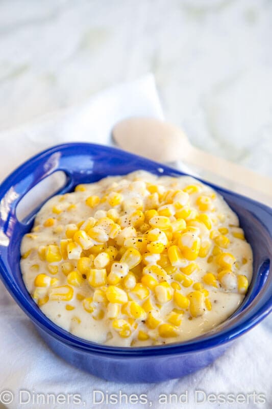 A bowl of corn in a blue dish