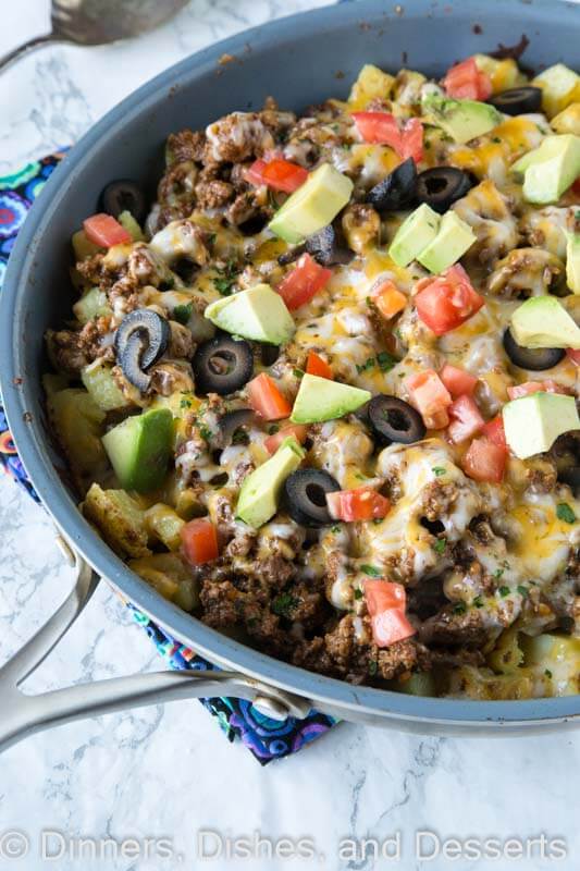 Mexican Skillet Potatoes - a quick and easy one pan Mexican recipe. Crispy potatoes, taco meat, salsa, cheese and more! So much better than just regular tacos.