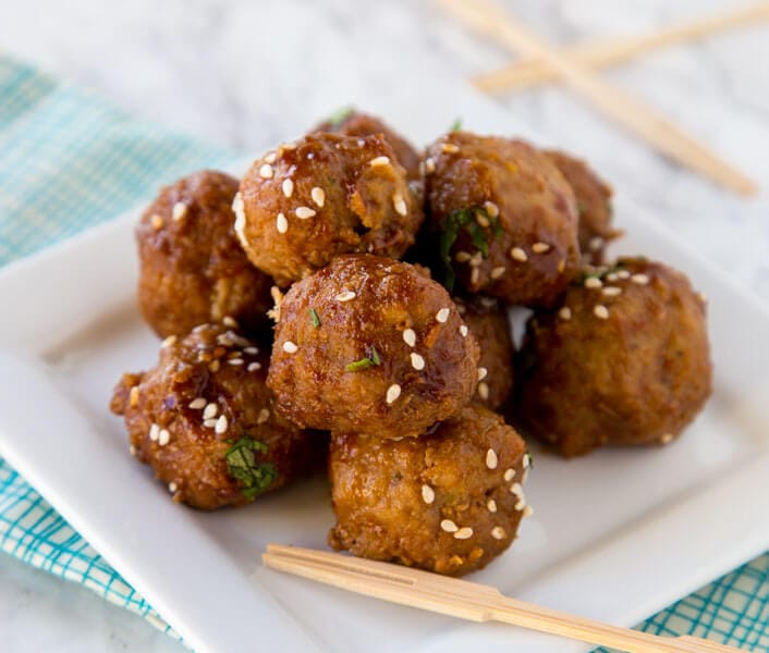 Crock Pot Honey Garlic Meatballs - super tender meatballs that simmer in a delicious honey garlic sauce. Great for an appetizer or over rice for dinner.