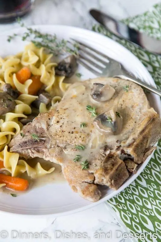 Slow Cooker Pork Chops - use bone in pork chops in the slow cooker for an easy dinner. Add some veggies, and you have a complete meal waiting for you at dinner time!