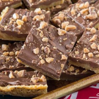 Chocolate Toffee Bars - crispy toffee flavored bars topped with chocolate and lots of bits of toffee. Just 6 ingredients, and so easy to make!