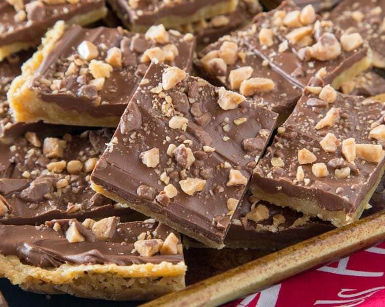 Chocolate Toffee Bars - crispy toffee flavored bars topped with chocolate and lots of bits of toffee. Just 6 ingredients, and so easy to make!