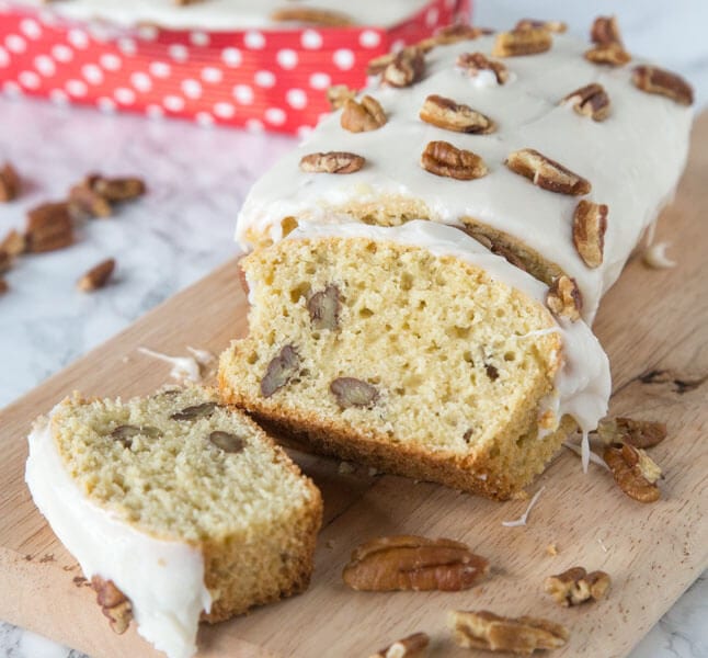Maple Pecan Loaf - A tender maple loaf studded with pecans and topped with a maple frosting. This recipe is great for gift giving any time of year.