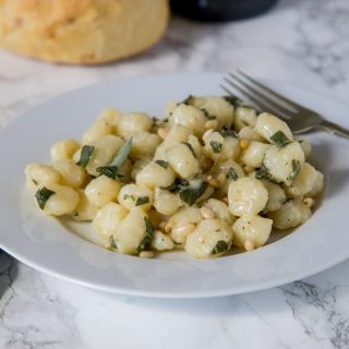 Parmesan Gnocchi with Sage Butter- comfort food that is on the table in 15 minutes. Soft gnocchi tossed with melted butter, sage, and Parmesan cheese!