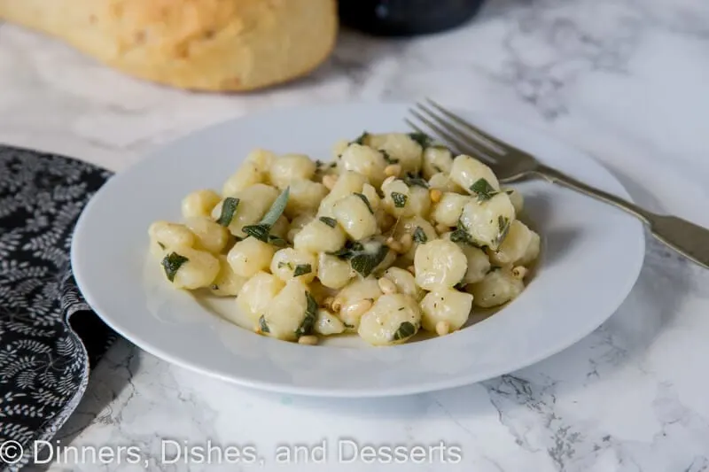 parmesan sage butter gnocchi on a plate with a fork