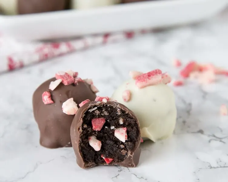Peppermint Oreo Truffles - classic Oreo truffles with bits of peppermint pieces to make them festive for the holidays.