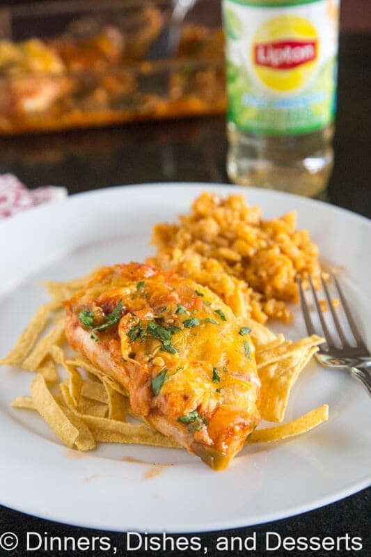 Southwest baked chicken on a plate with tortilla strips and a fork