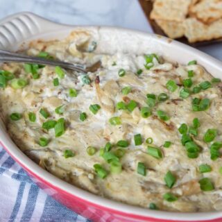 Cheesy Artichoke Dip - creamy, cheesy artichoke dip that is easy to make, has tons of flavor, and great for any get together or party.