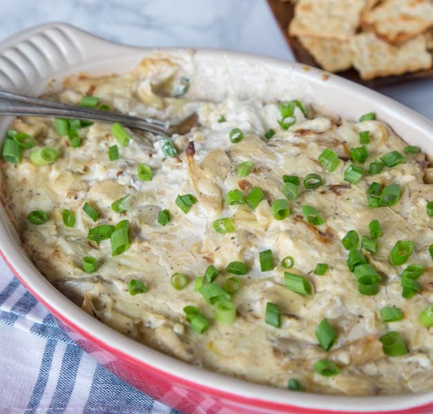 Cheesy Artichoke Dip - creamy, cheesy artichoke dip that is easy to make, has tons of flavor, and great for any get together or party.