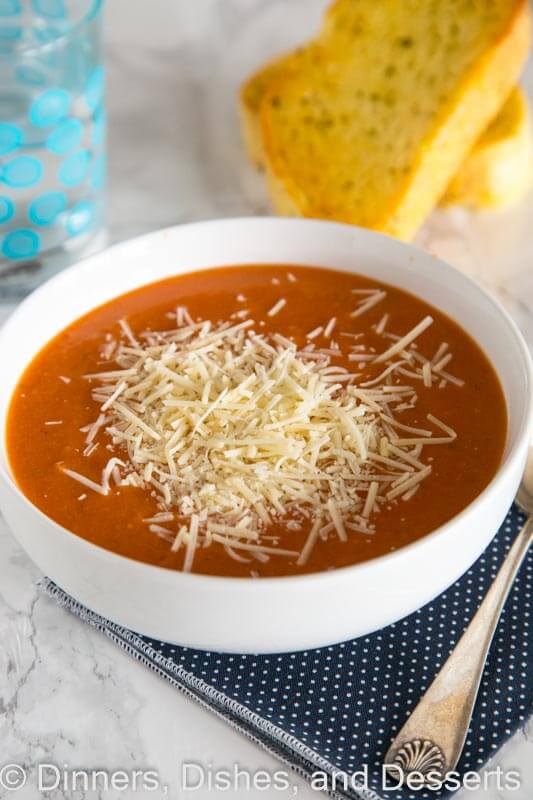 Creamy tomato soup in a bowl with cheese
