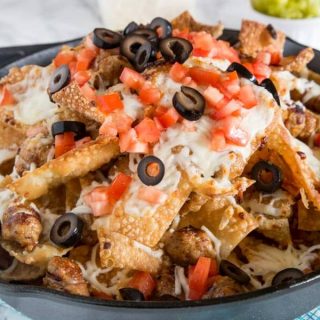 Italian Nachos with Sausage - Crispy wonton chips topped with plenty of cheese and Italian chicken sausage. Great appetizer for game day or any party!